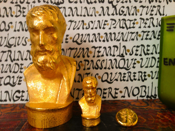 Small gold busts of Epicurus. Daric for size comparison.
